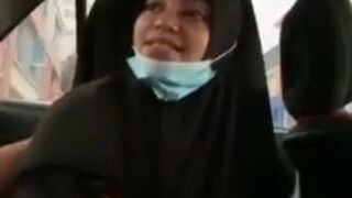 Tudung in a car doing oral sex and riding